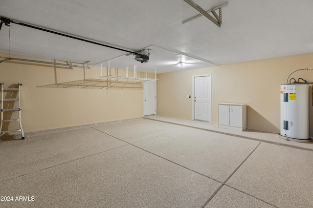 garage with water heater and a garage door opener