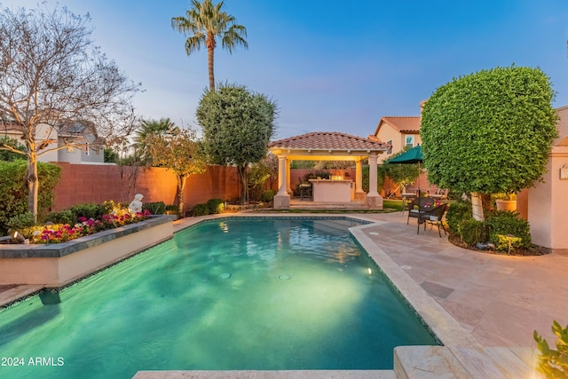 view of swimming pool featuring a gazebo and a patio area