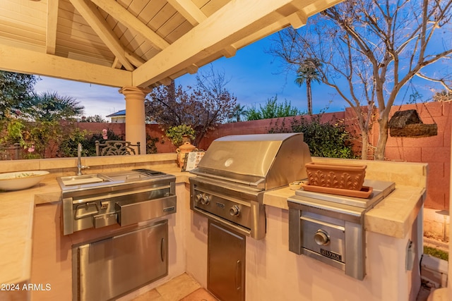 view of patio / terrace with area for grilling and an outdoor kitchen