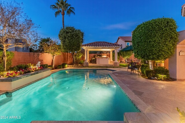 view of swimming pool with a gazebo, a patio area, and a hot tub