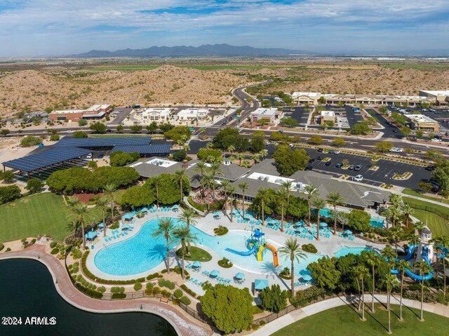 birds eye view of property with a mountain view