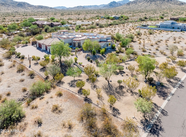 birds eye view of property featuring a mountain view