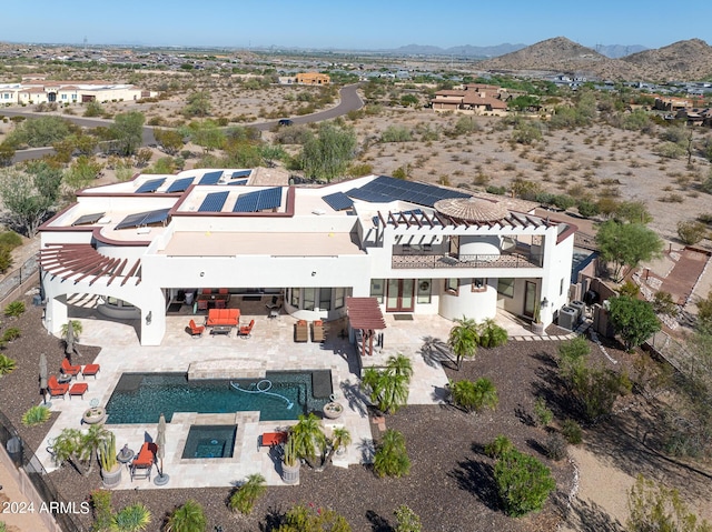 drone / aerial view featuring a mountain view