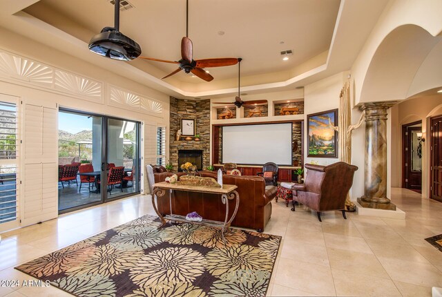 kitchen featuring appliances with stainless steel finishes, decorative backsplash, light tile patterned floors, and light stone counters