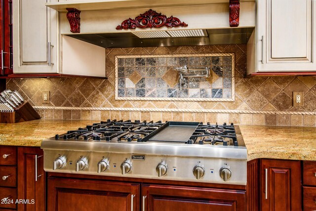 kitchen featuring appliances with stainless steel finishes, backsplash, and light tile patterned floors