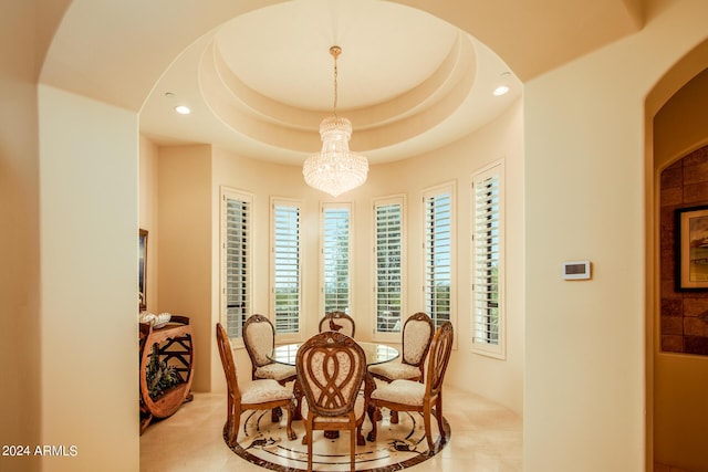 dining space with arched walkways, a notable chandelier, and recessed lighting