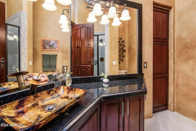 bathroom featuring tile patterned flooring and vanity