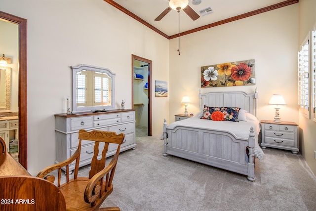 bedroom with light carpet, crown molding, visible vents, and multiple windows