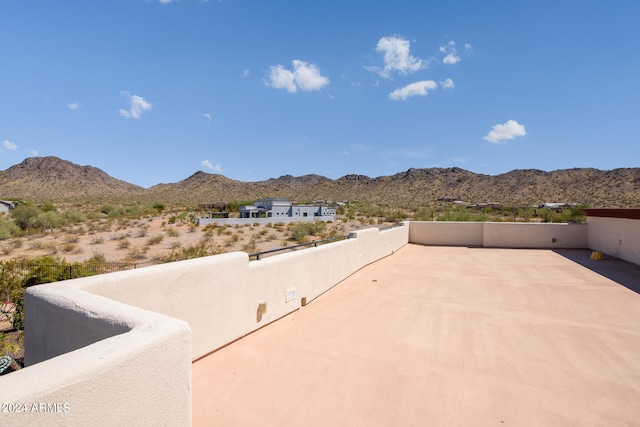 view of patio / terrace with a mountain view