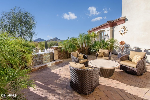 view of patio / terrace featuring a mountain view