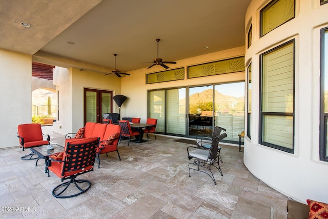 view of patio with outdoor lounge area, ceiling fan, and outdoor dining area