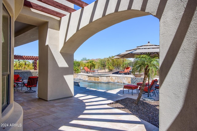 view of patio / terrace with a fenced in pool, an in ground hot tub, and a pergola