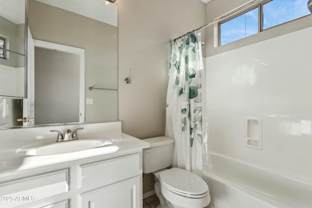 full bathroom featuring vanity, toilet, and shower / bath combo with shower curtain