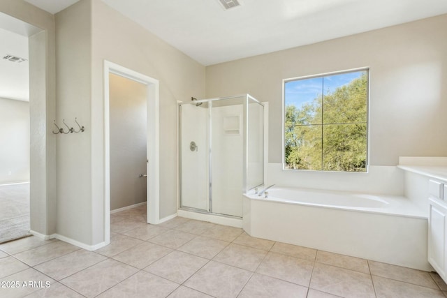 bathroom featuring tile patterned floors and plus walk in shower