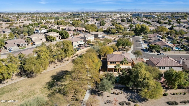 birds eye view of property with a mountain view