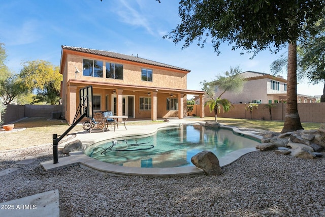 rear view of house featuring a fenced in pool, a patio, ceiling fan, and central air condition unit