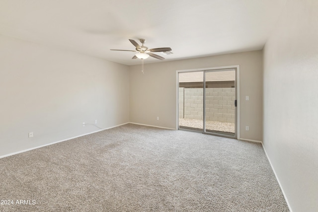 unfurnished room featuring baseboards, visible vents, and carpet flooring