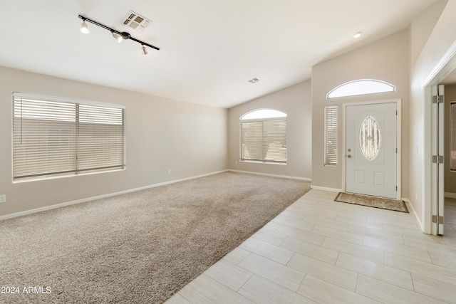 kitchen featuring a center island, decorative light fixtures, stainless steel appliances, visible vents, and decorative backsplash