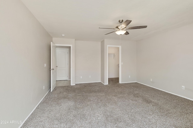 unfurnished bedroom featuring a closet, carpet, visible vents, and baseboards