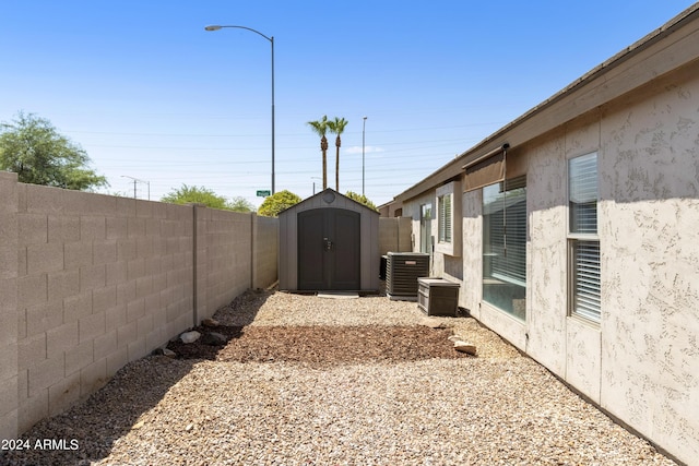 mediterranean / spanish house with an attached garage, a front yard, concrete driveway, and stucco siding