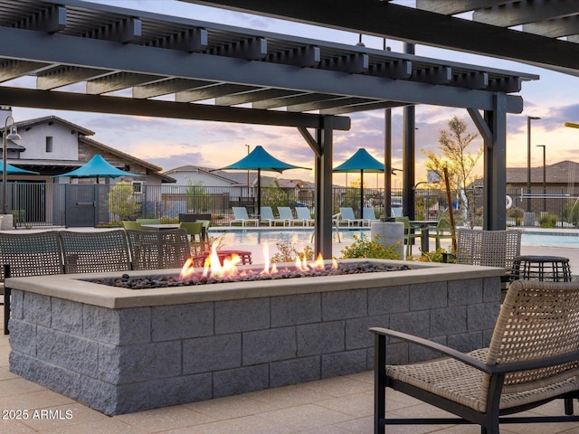 16005 W Bronco Trl, Surprise, AZ 85387 - view of patio with an outdoor fire pit, a community pool, and a pergola