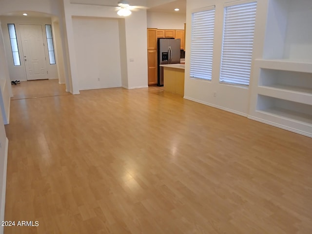 1970 W Park Pl, Chandler, AZ 85224 - unfurnished living room featuring arched walkways, light wood-style flooring, a ceiling fan, and recessed lighting