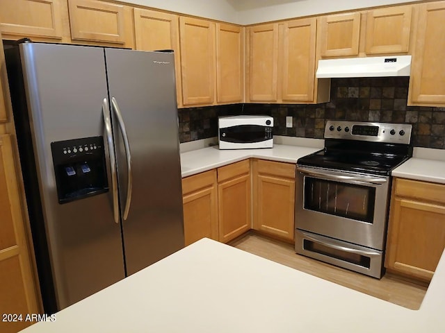 1970 W Park Pl, Chandler, AZ 85224 - kitchen featuring appliances with stainless steel finishes, under cabinet range hood, light countertops, backsplash, and light brown cabinetry