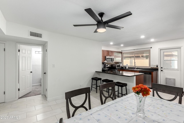 dining space featuring recessed lighting, visible vents, baseboards, ceiling fan, and light tile patterned flooring