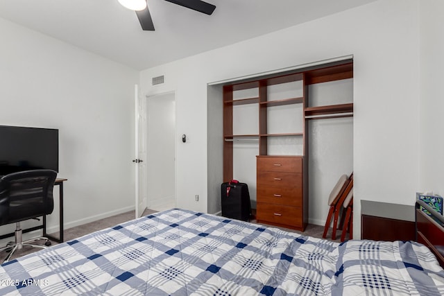 bedroom with baseboards, visible vents, ceiling fan, carpet flooring, and a closet