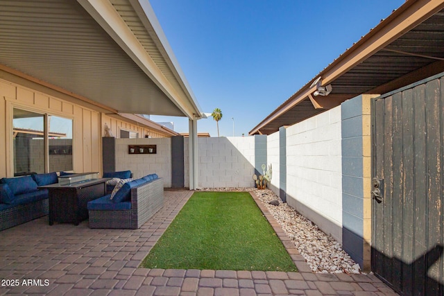 view of patio / terrace featuring a fenced backyard and an outdoor living space