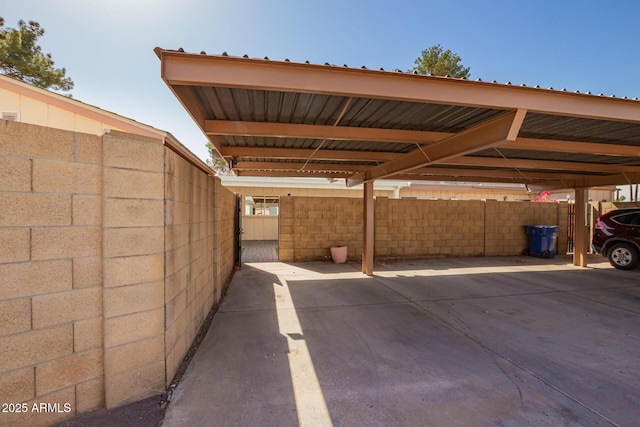 covered parking lot with fence