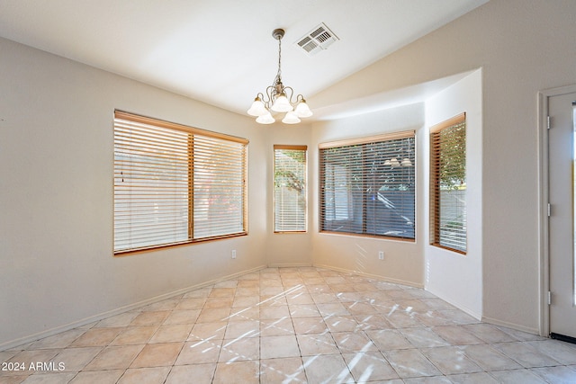 unfurnished dining area with light tile patterned floors, an inviting chandelier, and vaulted ceiling