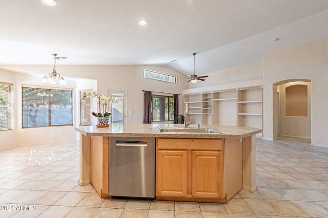 kitchen with a kitchen island with sink, hanging light fixtures, vaulted ceiling, stainless steel dishwasher, and light tile patterned floors