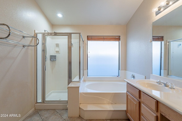 bathroom featuring tile patterned flooring, vanity, a healthy amount of sunlight, and shower with separate bathtub