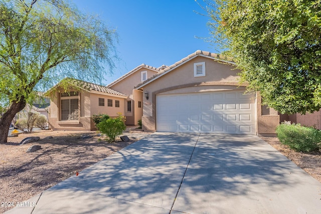 view of front of property featuring a garage