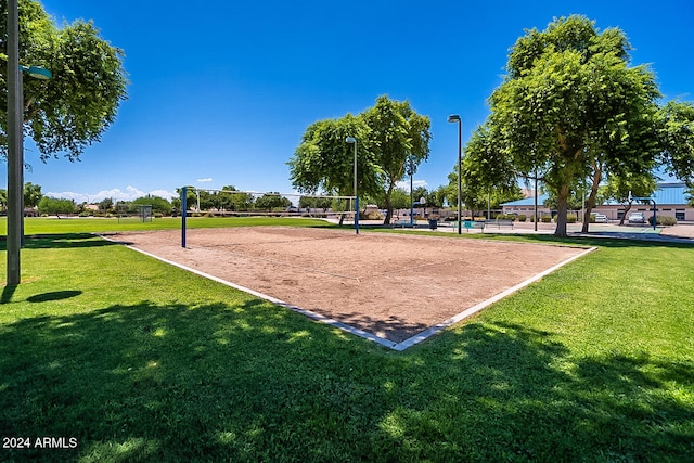 view of community featuring volleyball court and a lawn