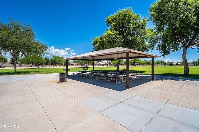 surrounding community with a gazebo and a yard