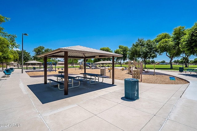 view of home's community featuring a gazebo, a playground, and a lawn