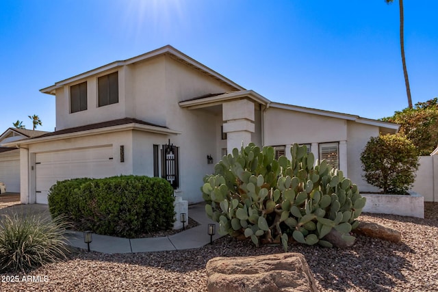 view of front of home with an attached garage and stucco siding