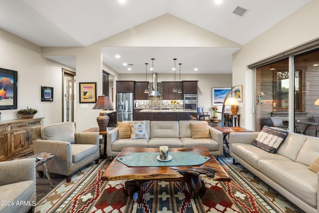 living room featuring vaulted ceiling