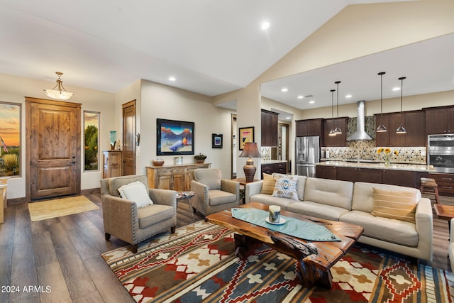 living room with lofted ceiling and dark wood-type flooring