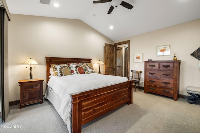 bedroom featuring a closet, ceiling fan, light carpet, and vaulted ceiling