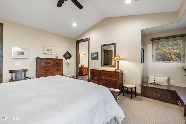 carpeted bedroom featuring ceiling fan and vaulted ceiling