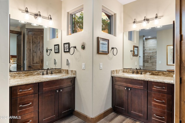 bathroom with vanity and hardwood / wood-style flooring