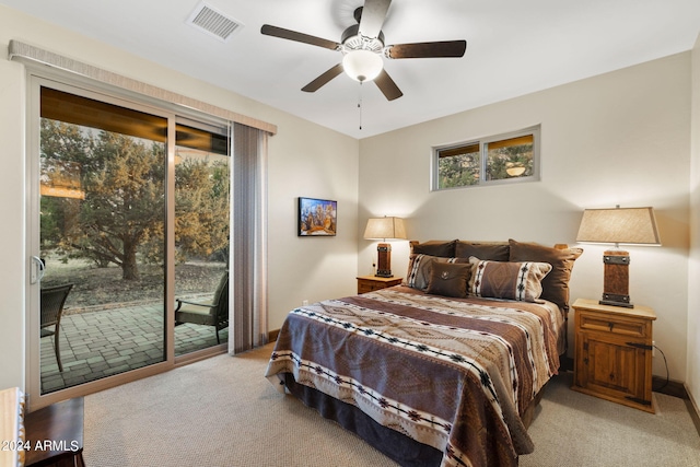 bedroom featuring light carpet, access to exterior, and ceiling fan