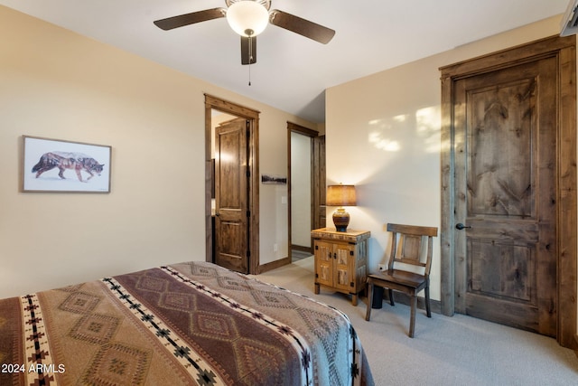 bedroom with light colored carpet and ceiling fan