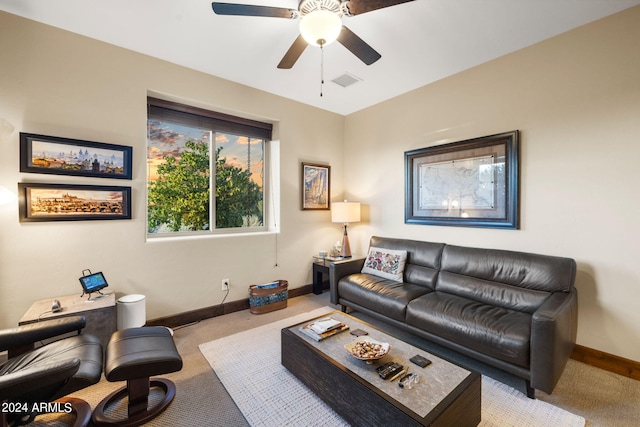 living room with light carpet and ceiling fan