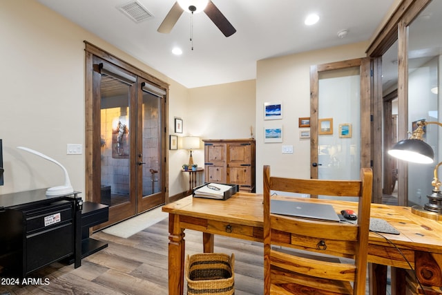 home office featuring french doors, wood-type flooring, and ceiling fan