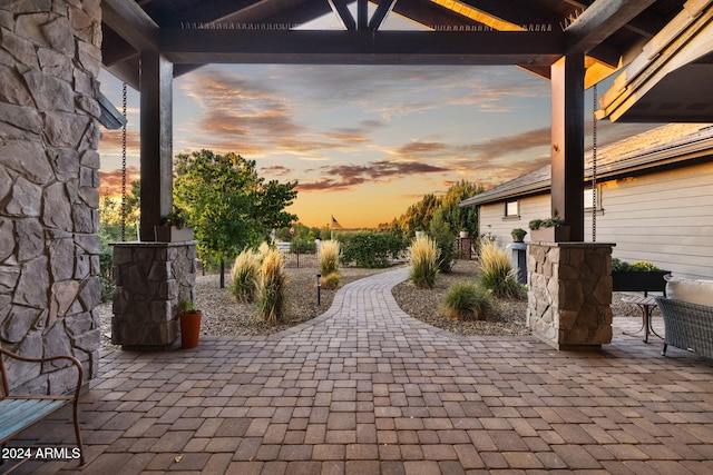 view of patio terrace at dusk