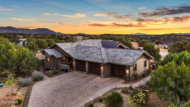 view of front of house featuring a garage and a mountain view